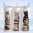 Three skinny cats sit atop stacks of books with a snowy landscape background.