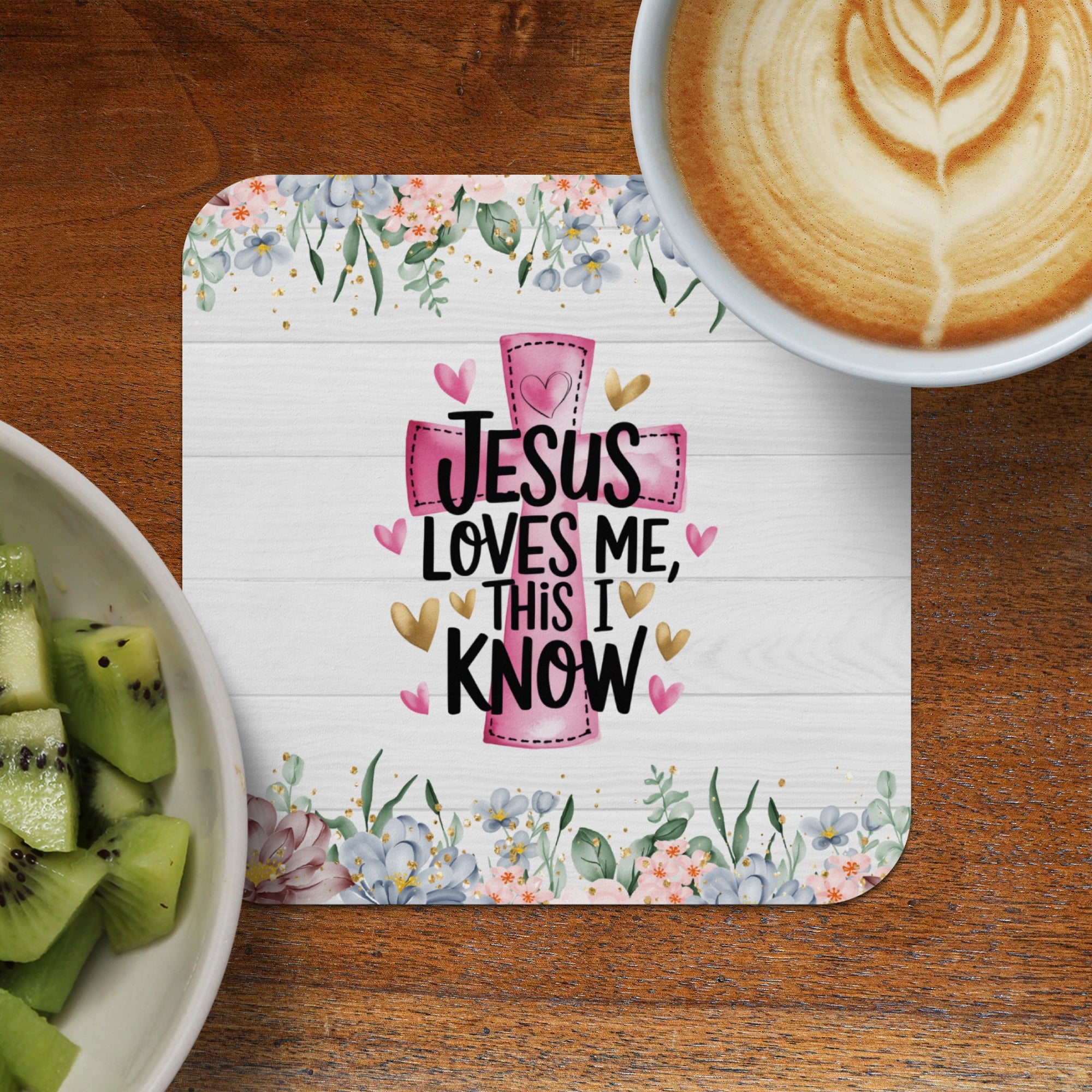 Cross with text "JESUS LOVES ME, THIS I KNOW" surrounded by floral pattern.