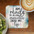 Coaster with "I am ready to allow miracles into my life" text, with fruit and coffee.