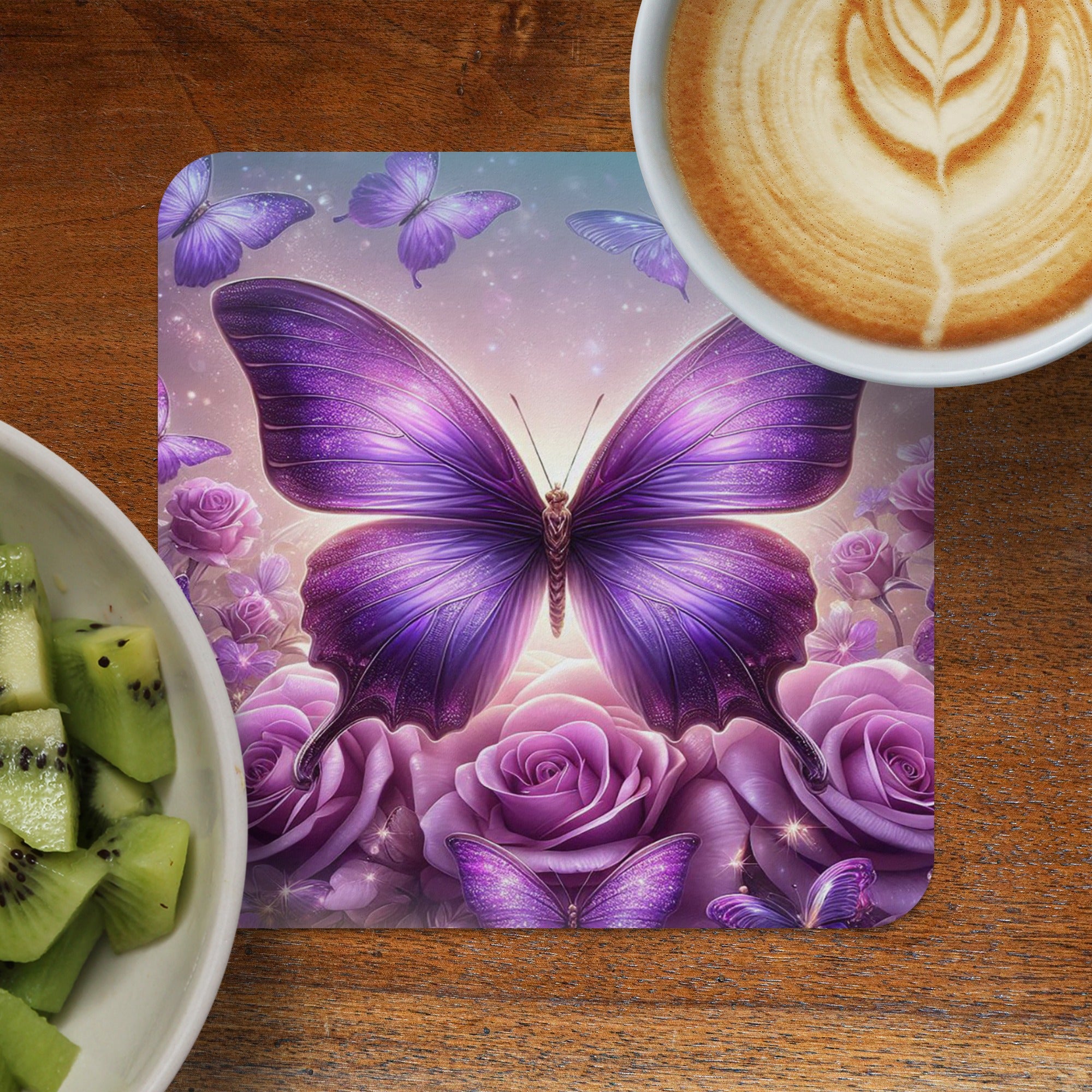 Purple butterfly on a bed of roses, with latte and kiwi in foreground.