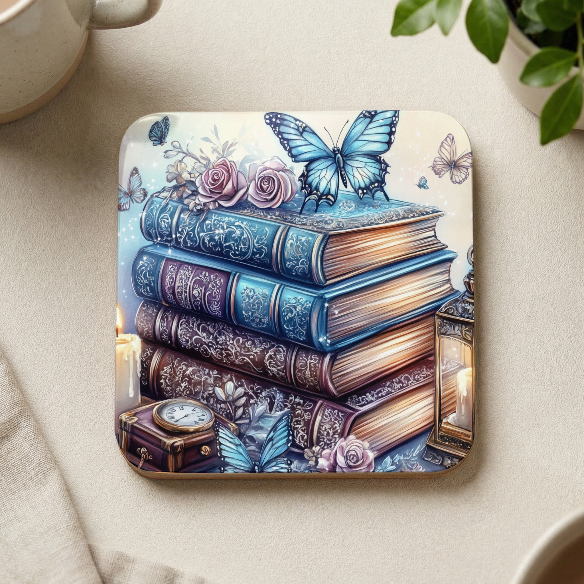 Stack of ornate antique books with butterflies, roses, and a vintage lantern.