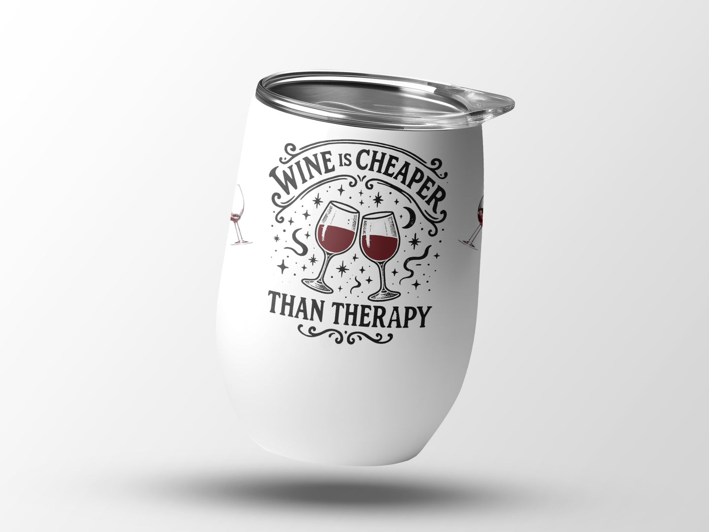 White tumbler with "Wine is cheaper than therapy" text and wine glasses.
