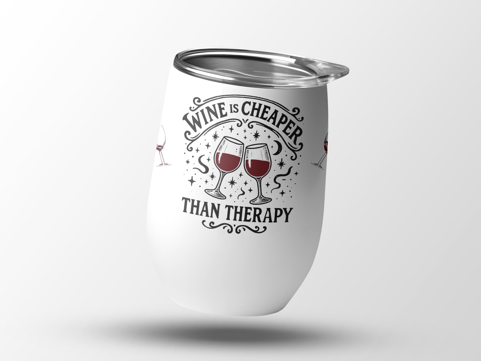 White tumbler with "Wine is cheaper than therapy" text and wine glasses.