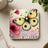 Square coaster with watercolor butterfly, pink flowers, and text "Failing means I'm learning."