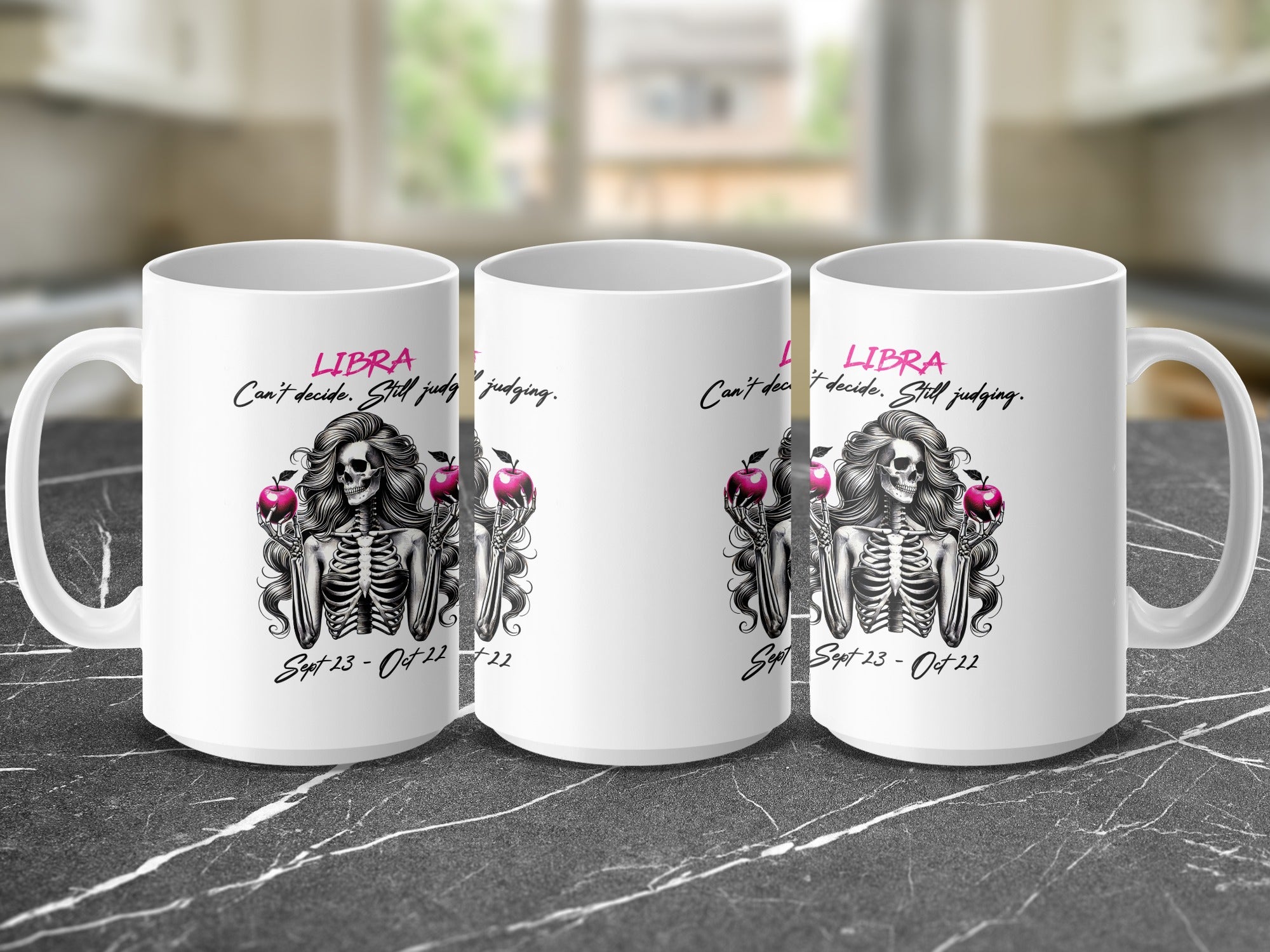 Three white mugs displaying a Libra zodiac design with a skeleton and apples.