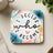 Coaster with colorful floral design and text "I DECIDE who I BECOME".
