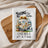 Waffle weave kitchen towel with vintage camper and text "Living the dream, One mile at a time".