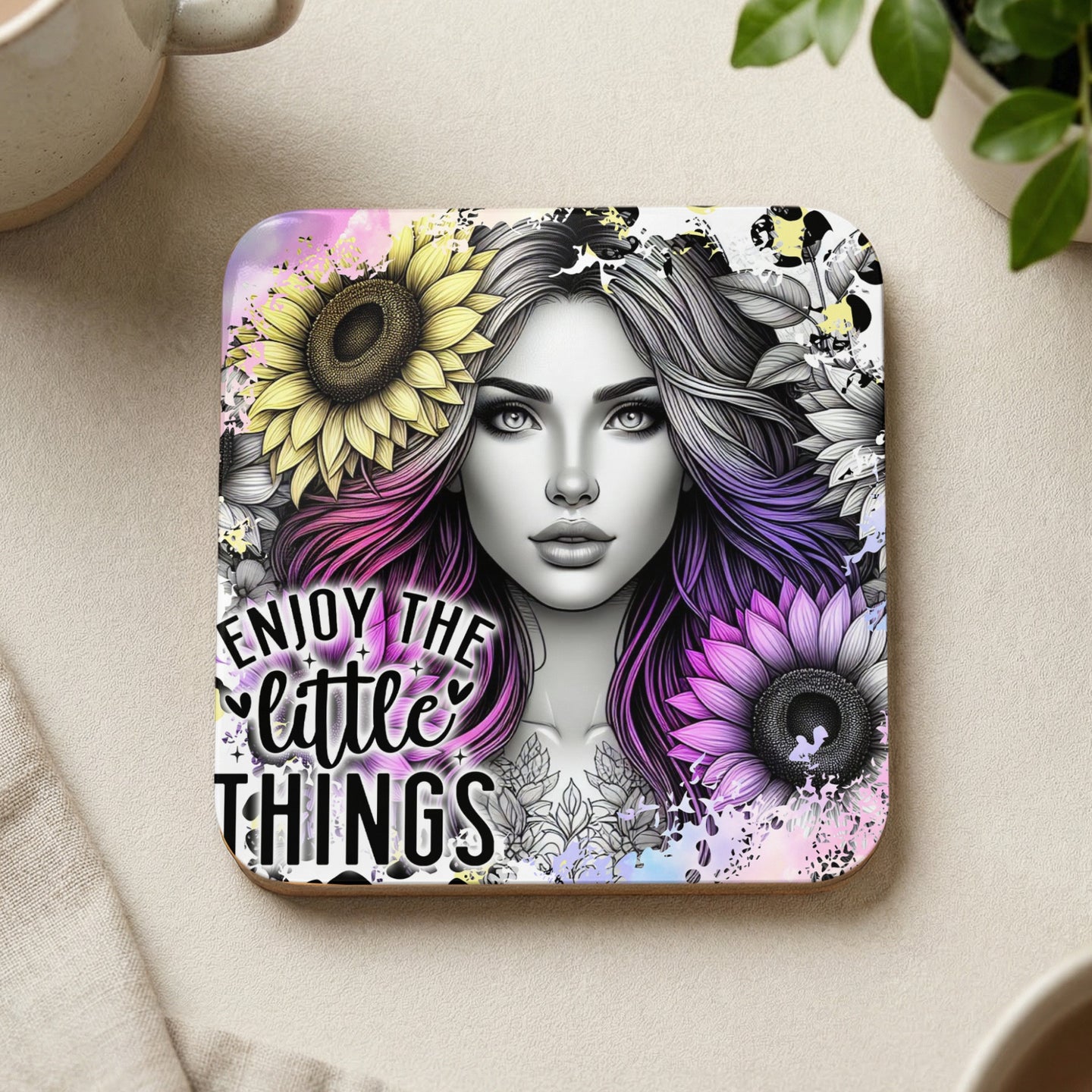 Coaster with colorful woman and sunflowers, text "Enjoy the little things".