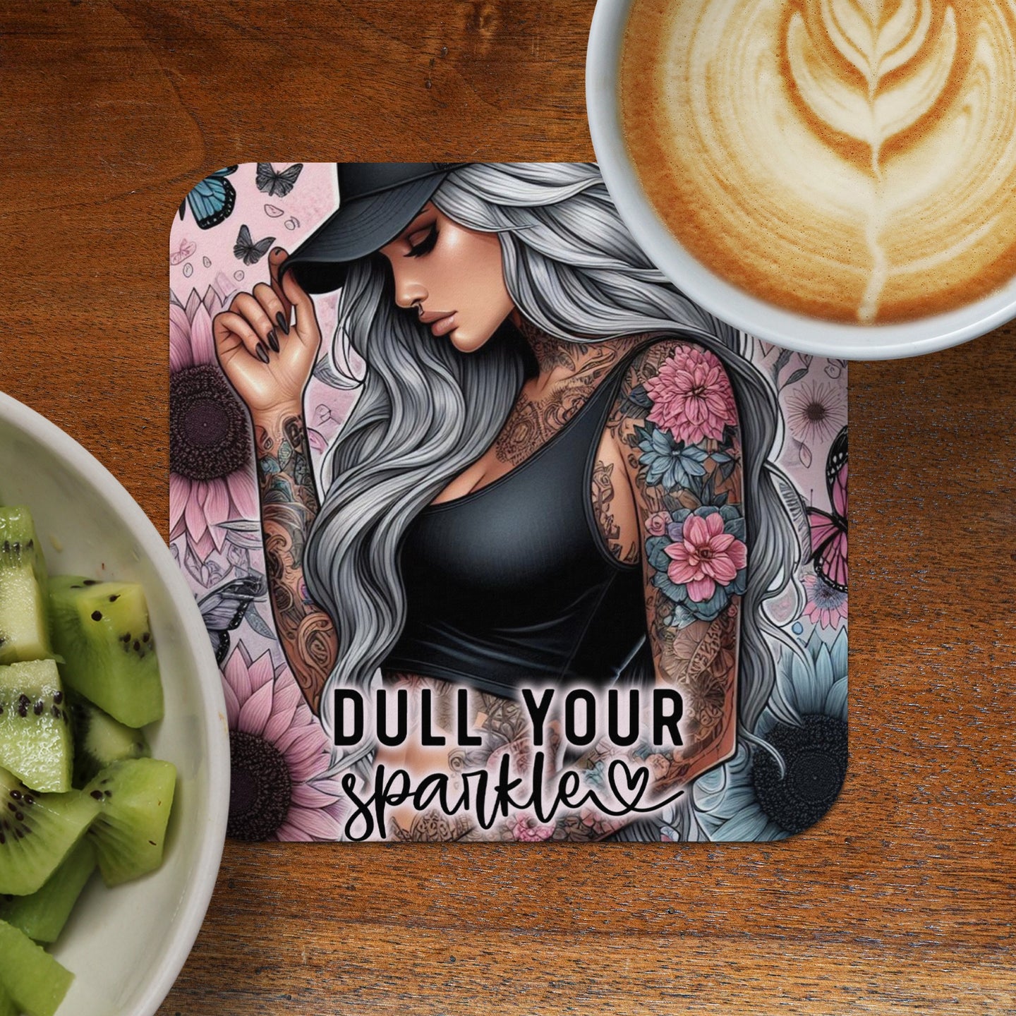 Tattooed woman with flowers and butterflies, "Dull Your Sparkle" text.