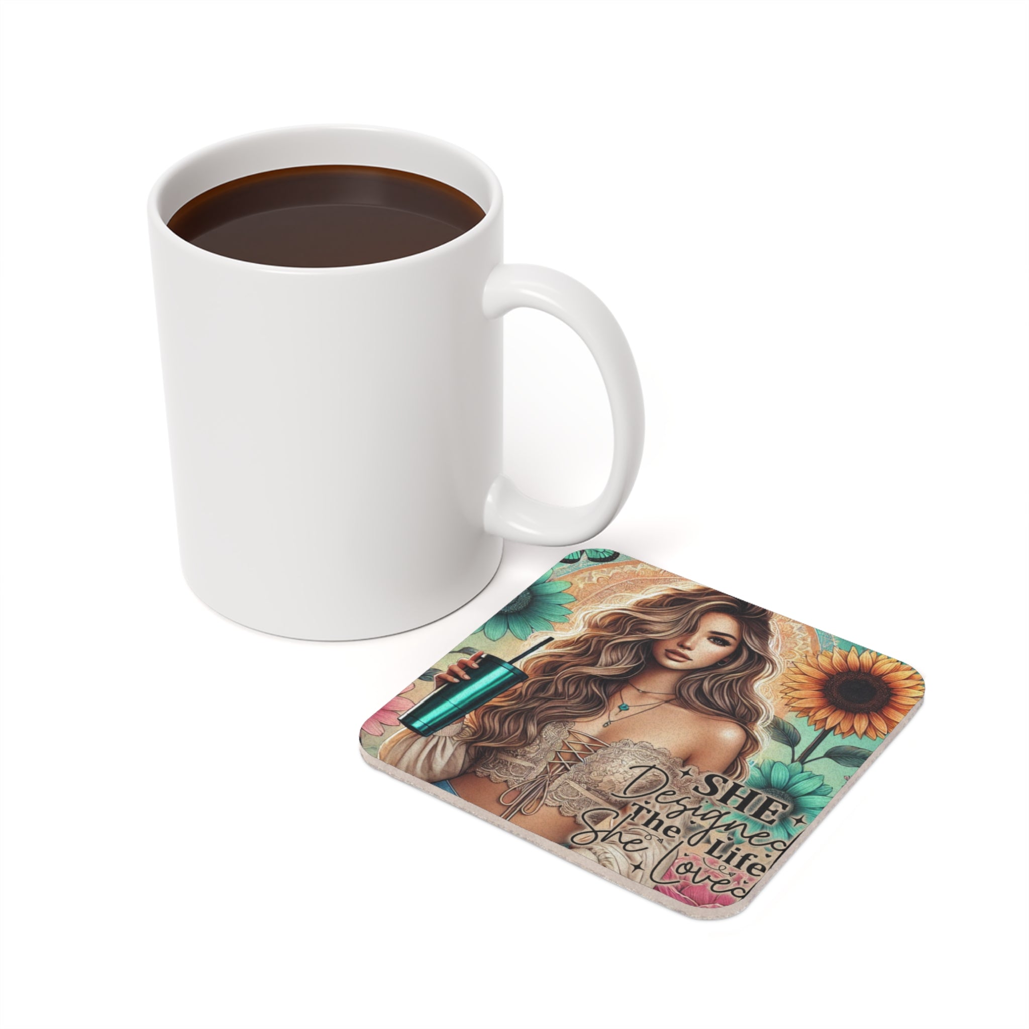 Coaster with woman and "She designed the life she loved" quote next to coffee mug.