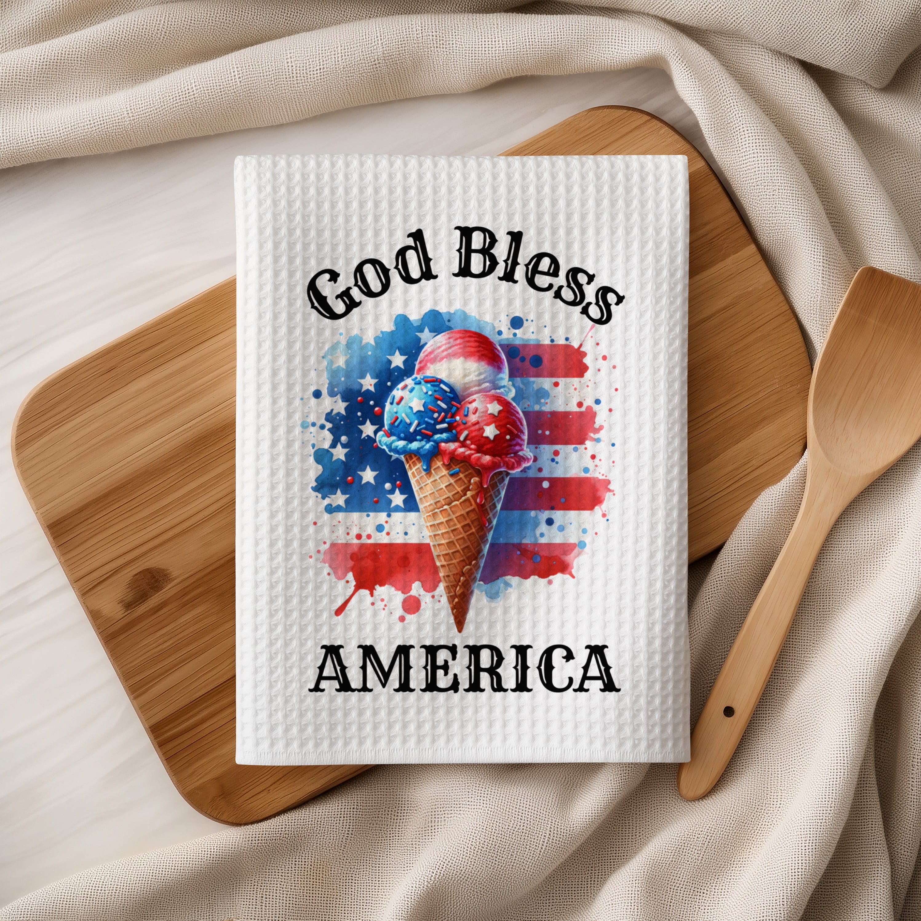 Ice cream cones with "God Bless America" text overlay on waffle towel.