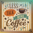 Less talk more coffee text on a background with coffee beans and a steaming cup.