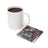 White mug beside a coaster with a colorful woman and "YOU ARE BRAVE" text.