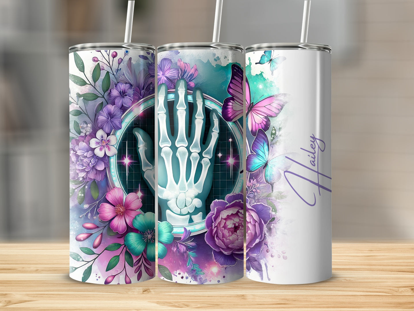 Floral and butterfly design with skeleton hand on a tumbler.