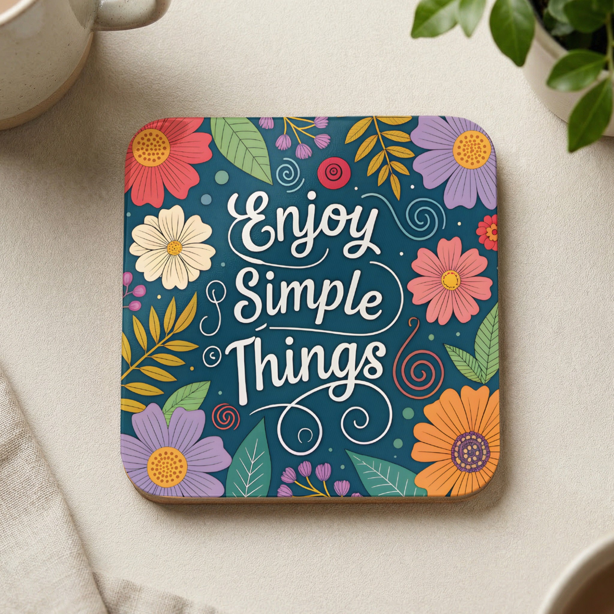 Coaster with "Enjoy Simple Things" text and colorful floral design.