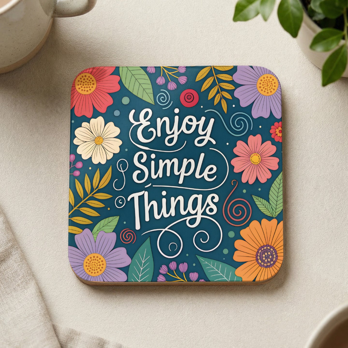 Coaster with "Enjoy Simple Things" text and colorful floral design.