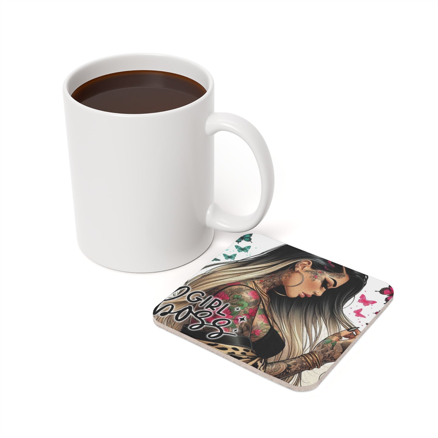 White mug with coffee next to a tattooed woman and butterfly coaster.