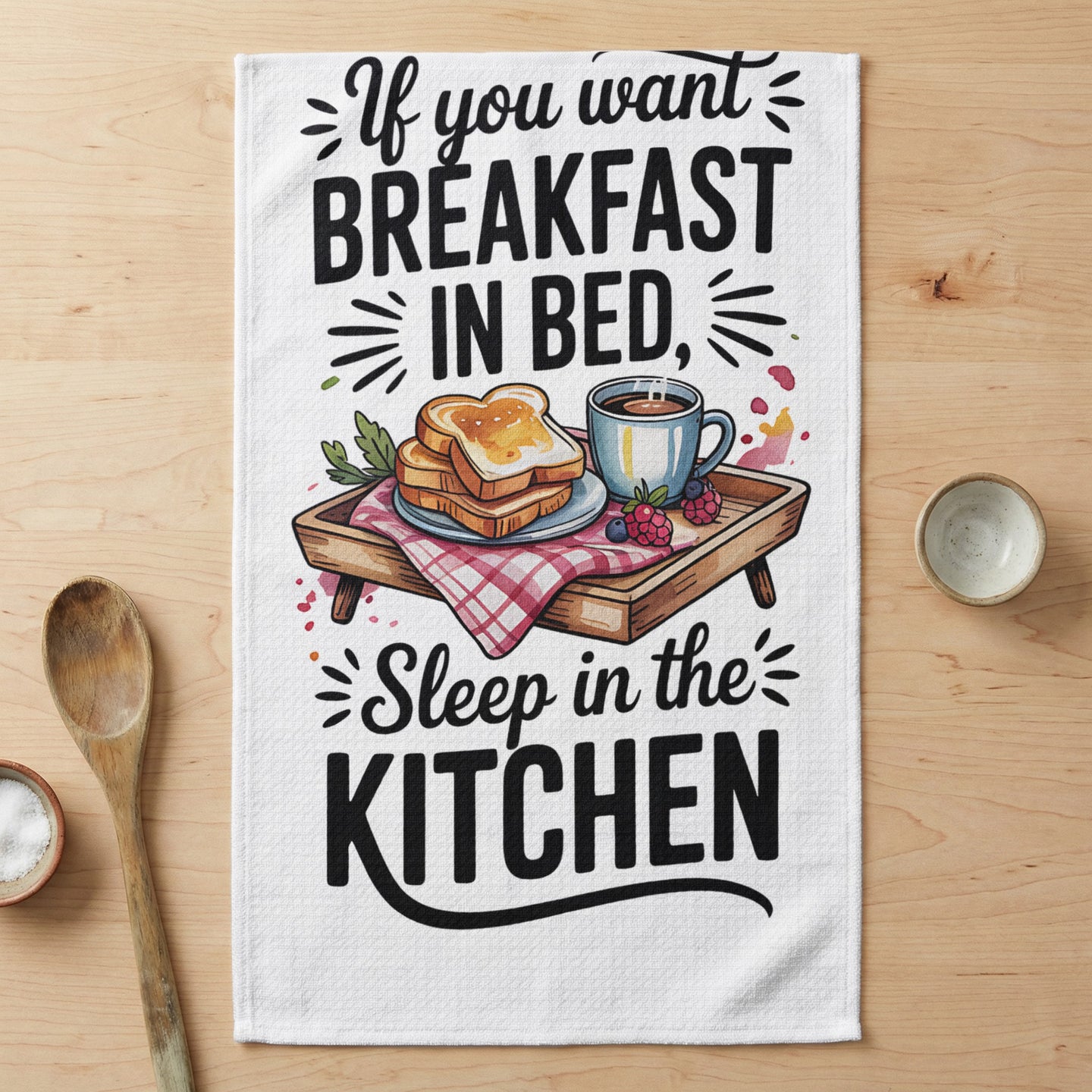 Towel with "If you want breakfast in bed, sleep in the kitchen" text.