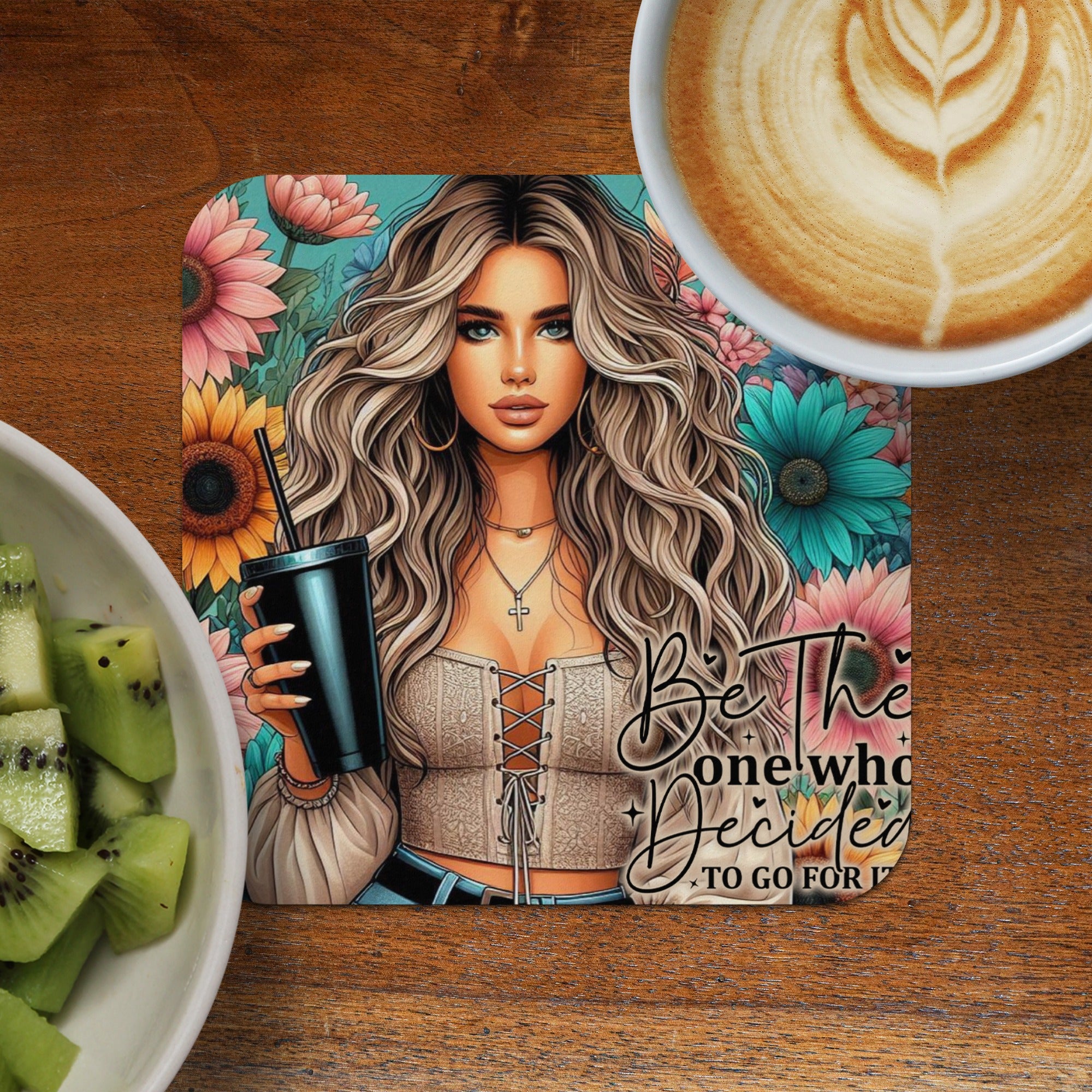 Woman with curly blonde hair holding a black cup, floral background, "Be the one who decided to go for it."