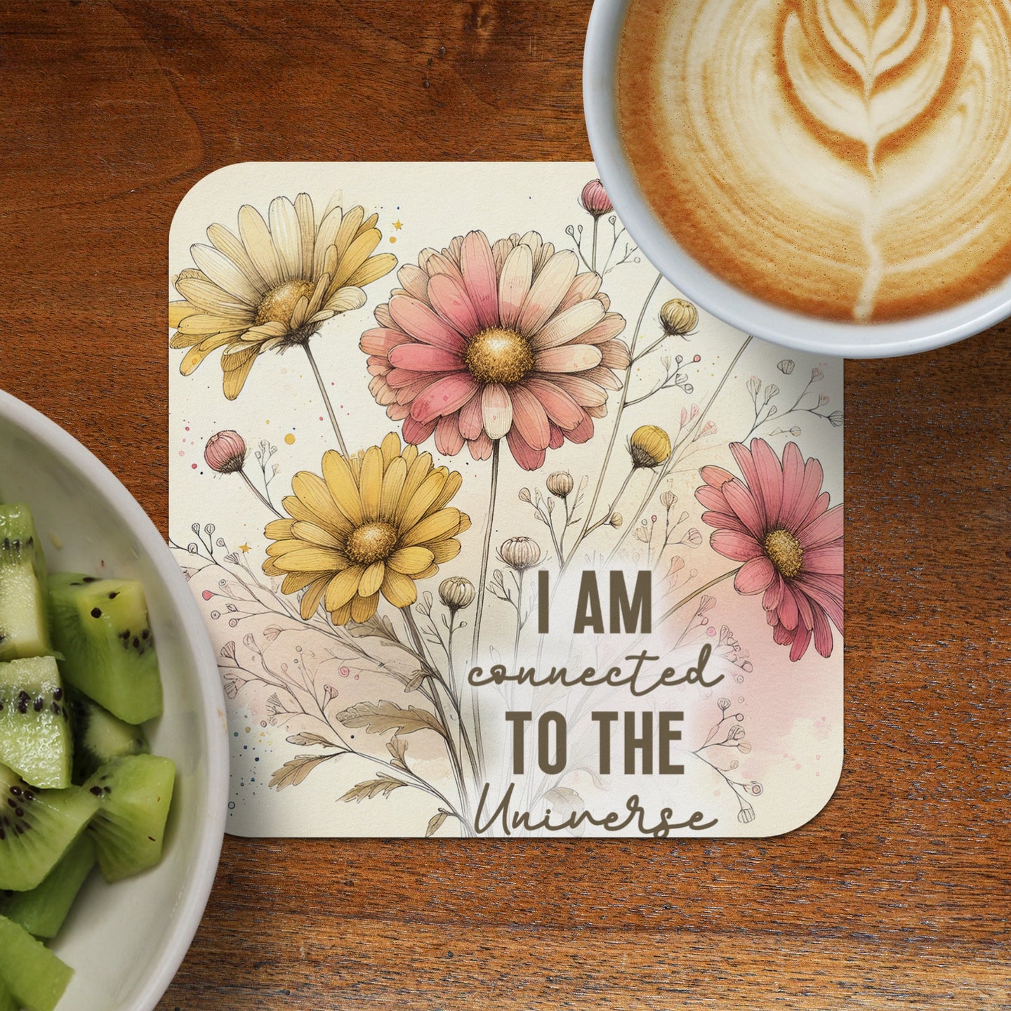 Coaster with daisies and text "I AM CONNECTED TO THE UNIVERSE".