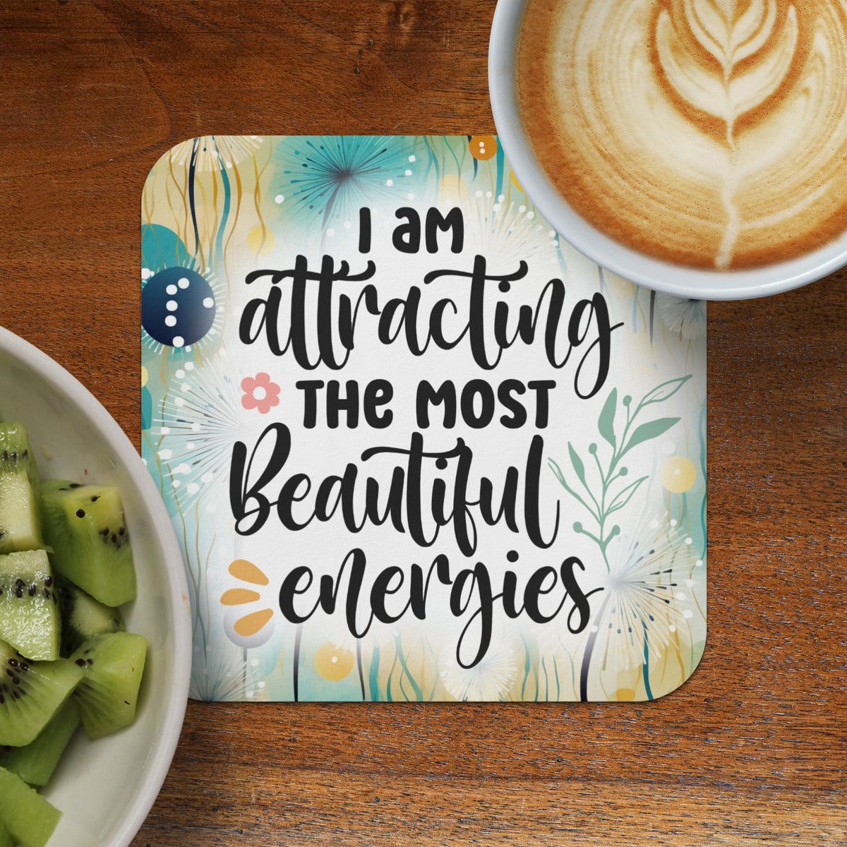 Coaster with floral design and the text "I am attracting the most beautiful energies."