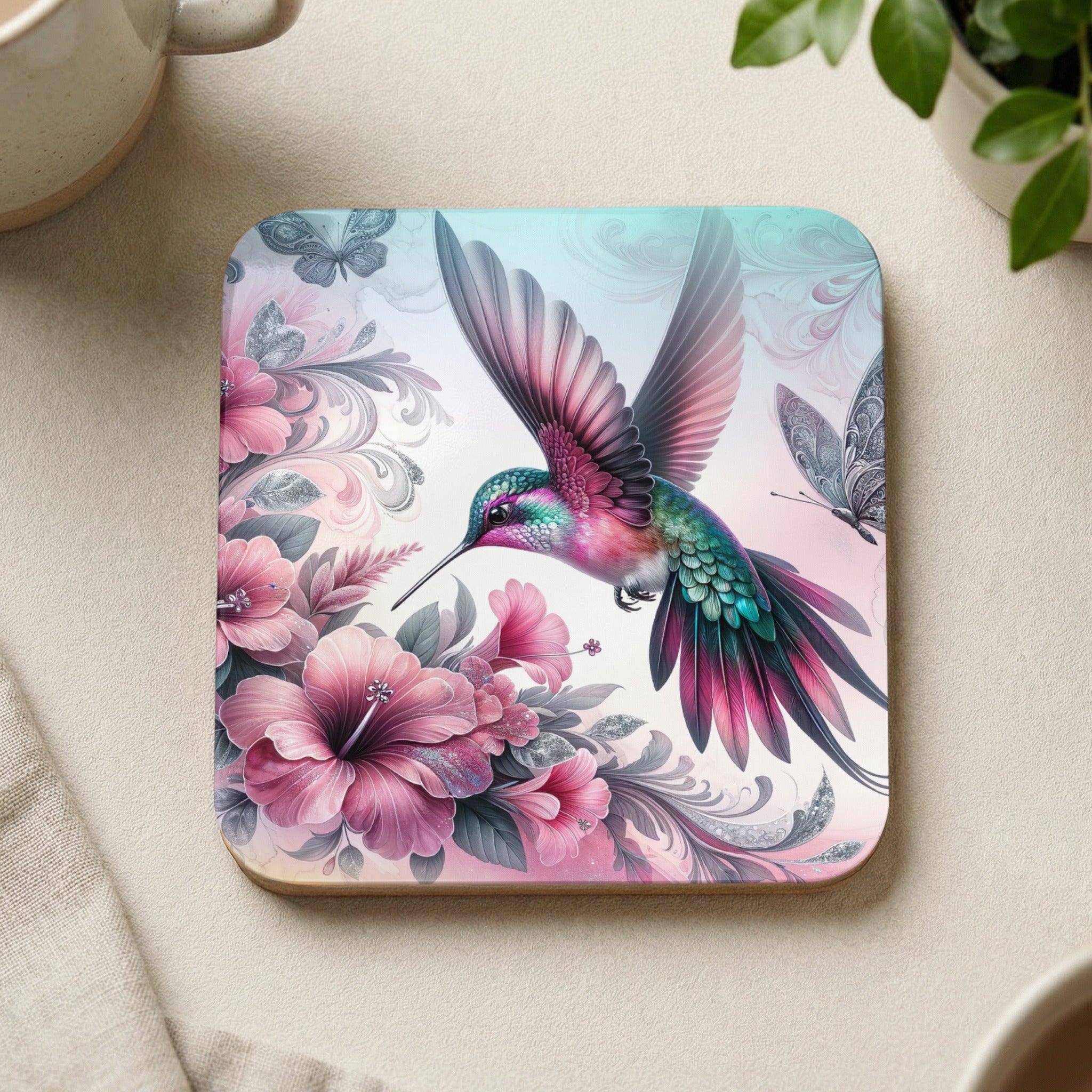 Hummingbird with pink flowers and butterflies on square coaster.