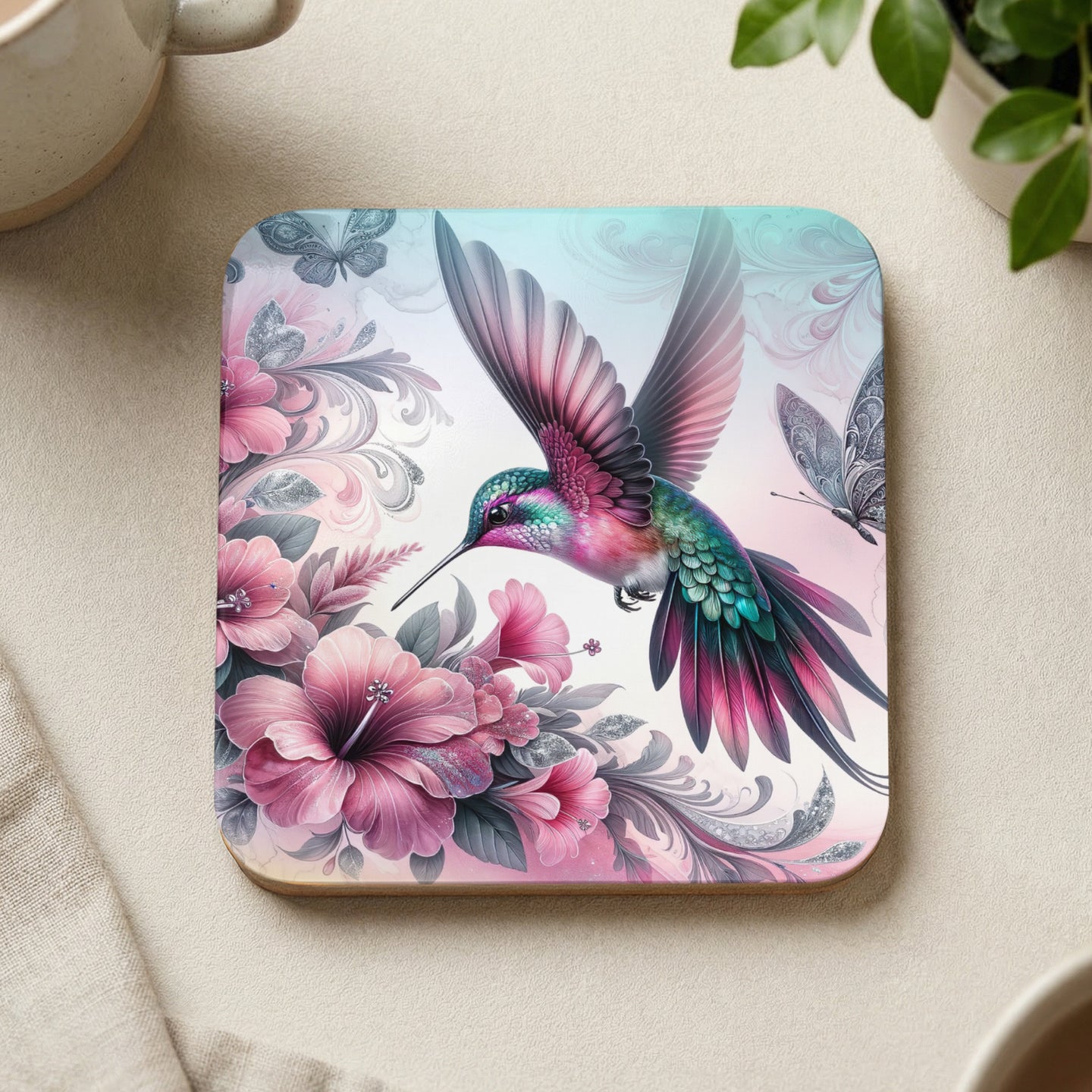 Hummingbird with pink flowers and butterflies on square coaster.