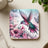 Hummingbird with pink flowers and butterflies on square coaster.