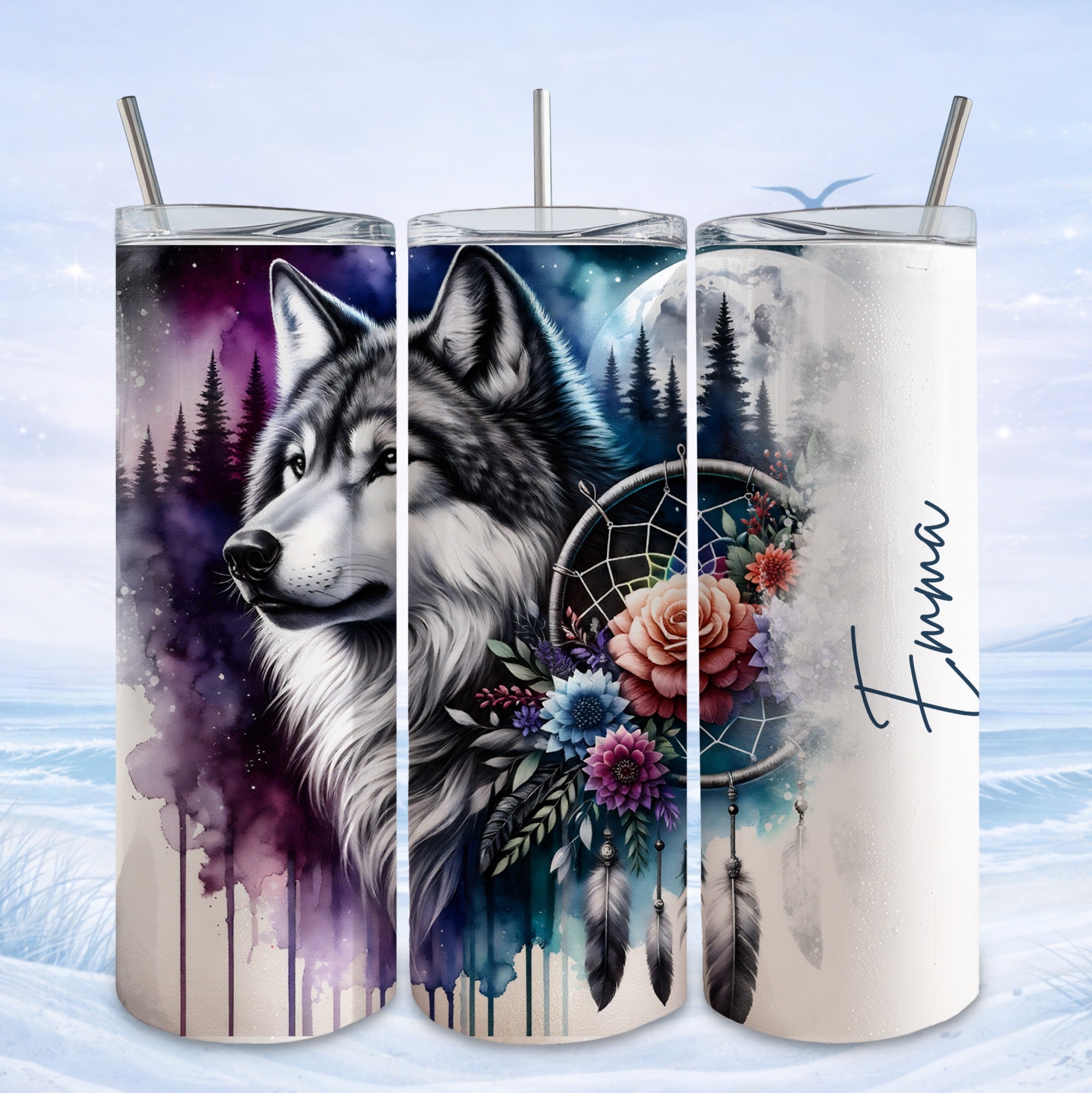 Wolf and floral dreamcatcher design on three tumblers, one personalized with "Emma".