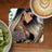 Tattooed woman with butterflies and "Girl Boss" text on a coaster.