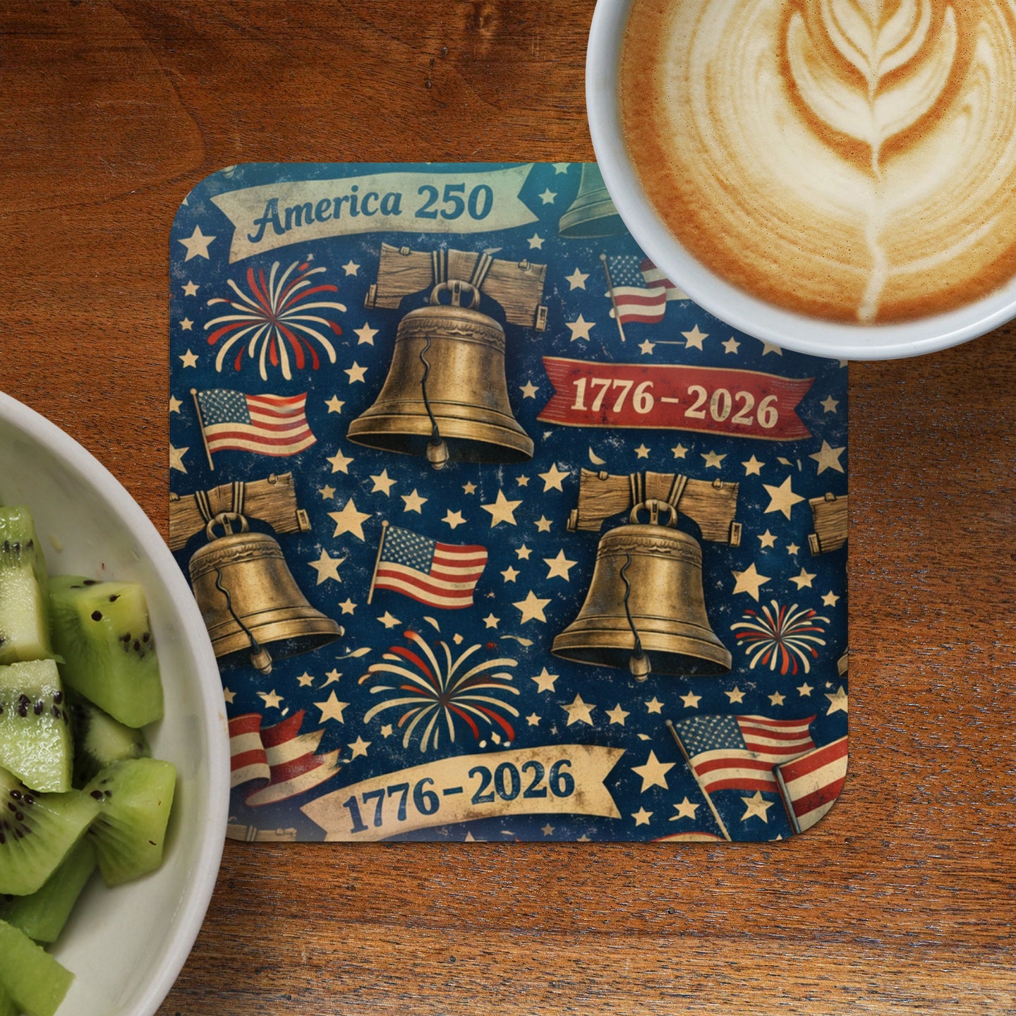 Patriotic coaster with Liberty Bells, flags, and fireworks, dated 1776-2026.