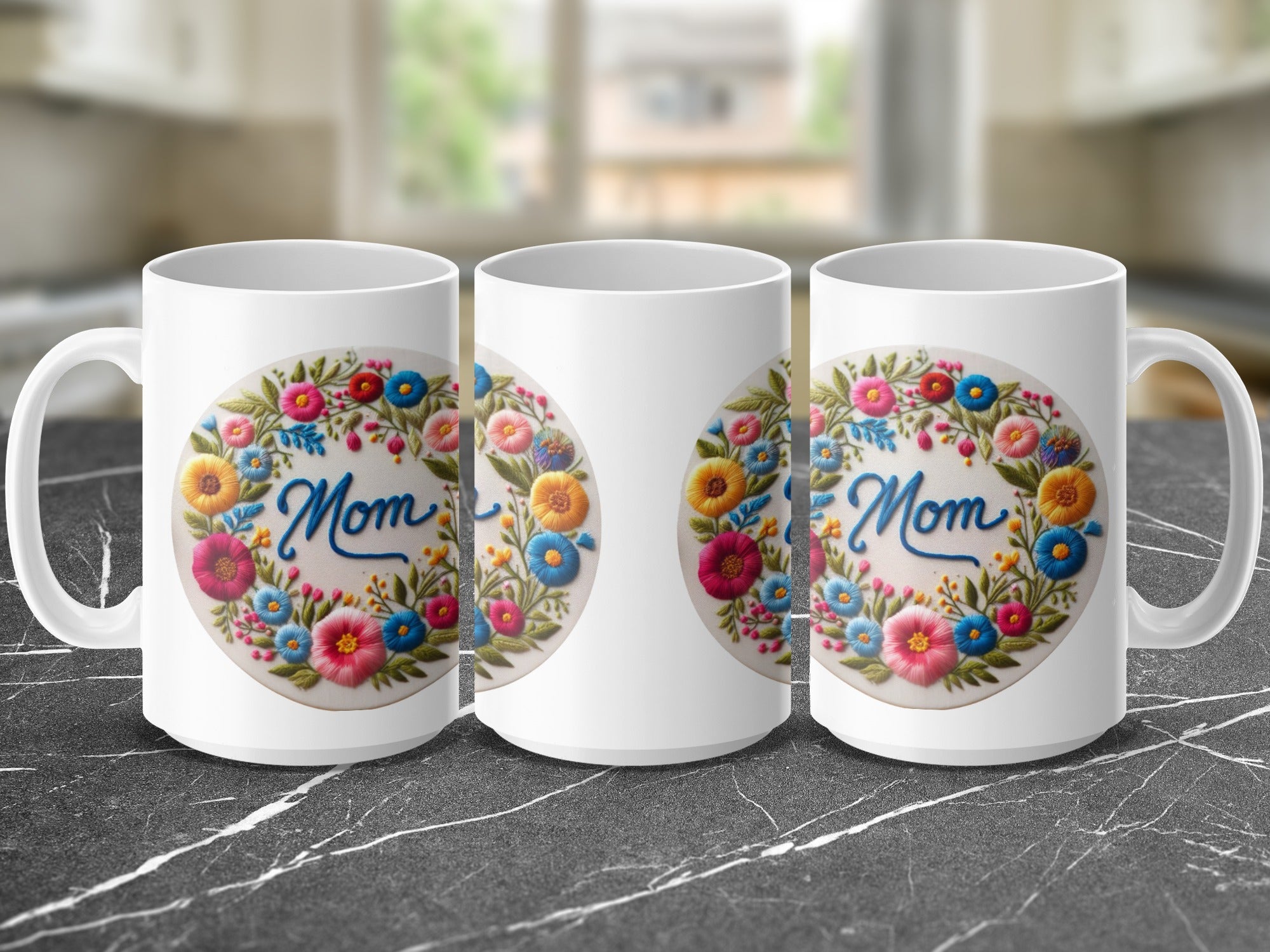 Three white mugs with "Mom" and floral wreath decoration.