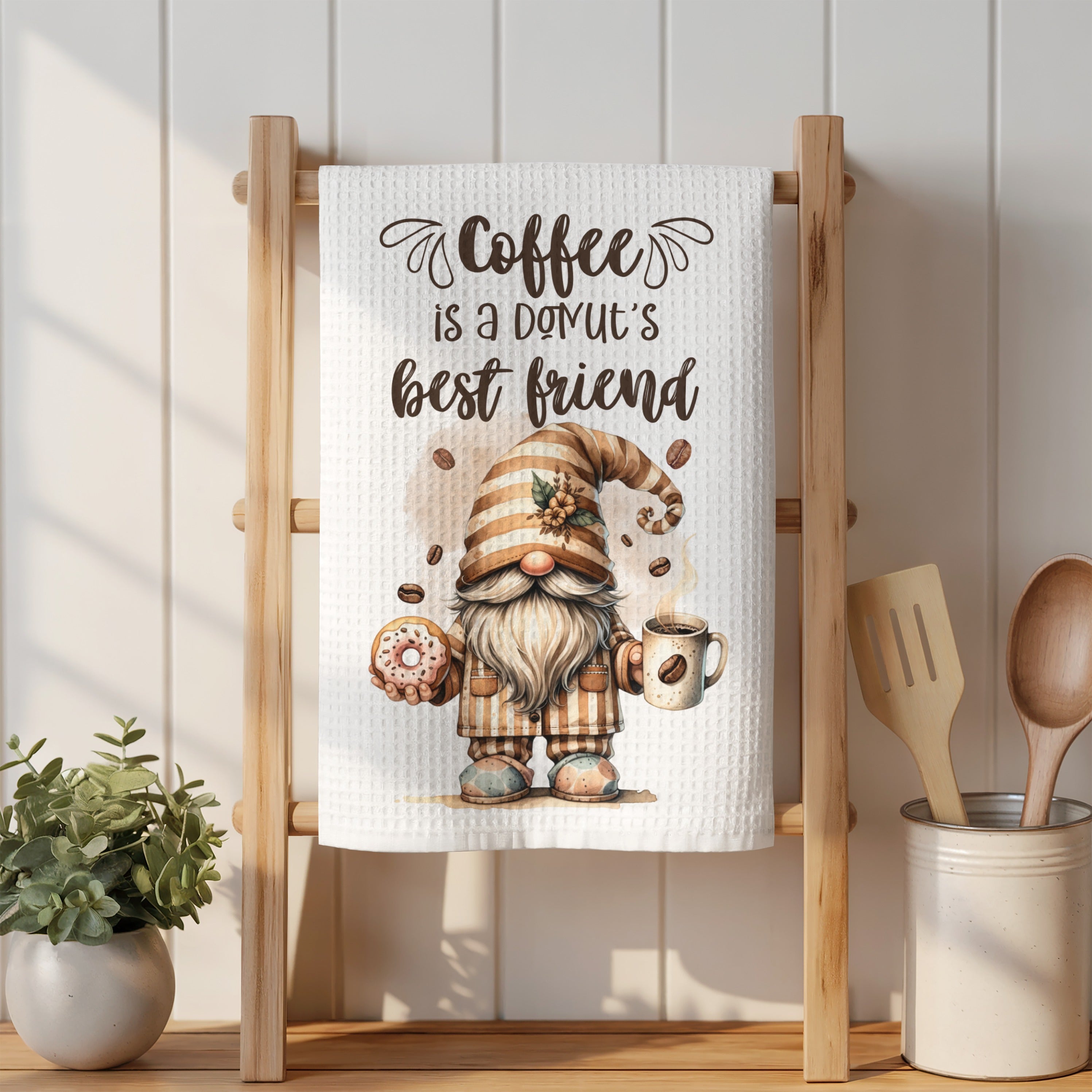 Gnome holding donut and coffee mug with text "Coffee is a donut's best friend".