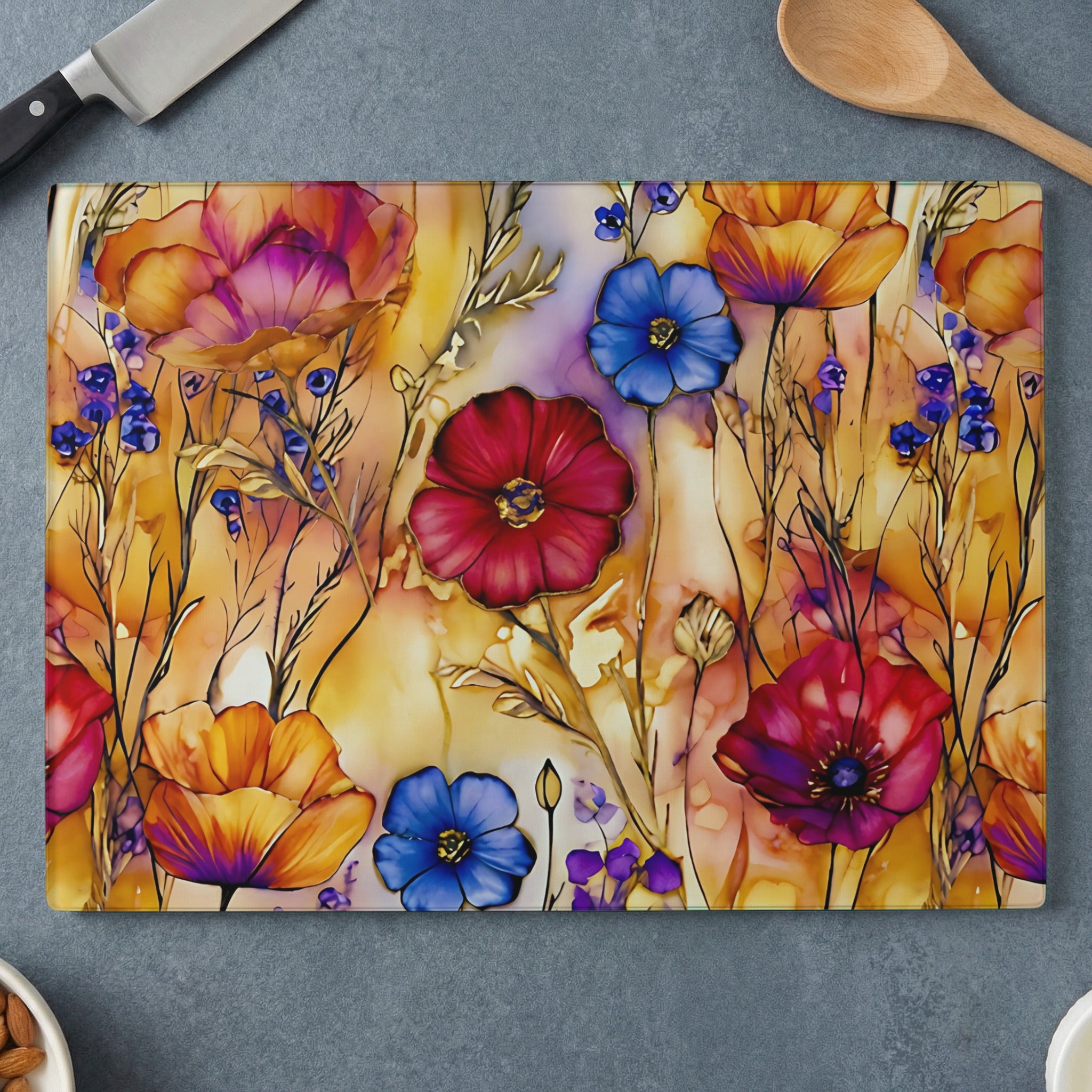 Glass cutting board with colorful poppies and wildflowers design.