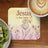 Jesus is the light coaster with floral design next to kiwi and coffee.