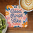 Coaster with "Good things Take time" text, latte, and kiwi on a wooden table.
