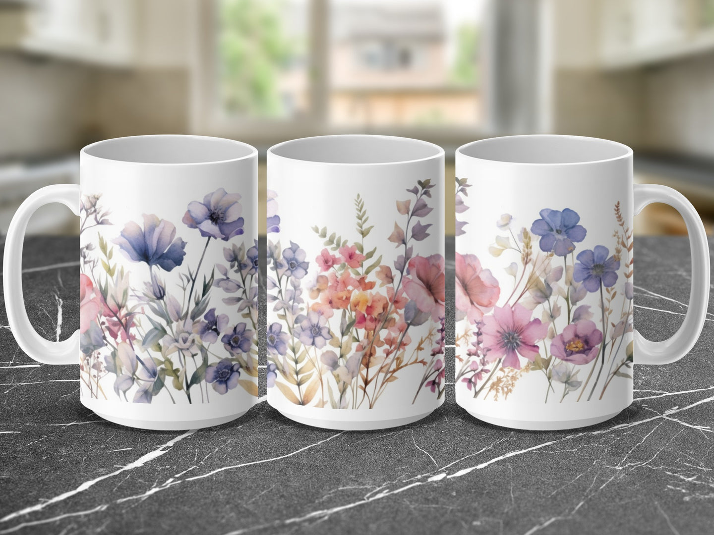 Three white mugs with watercolor floral designs, featuring purple, pink, and blue flowers.