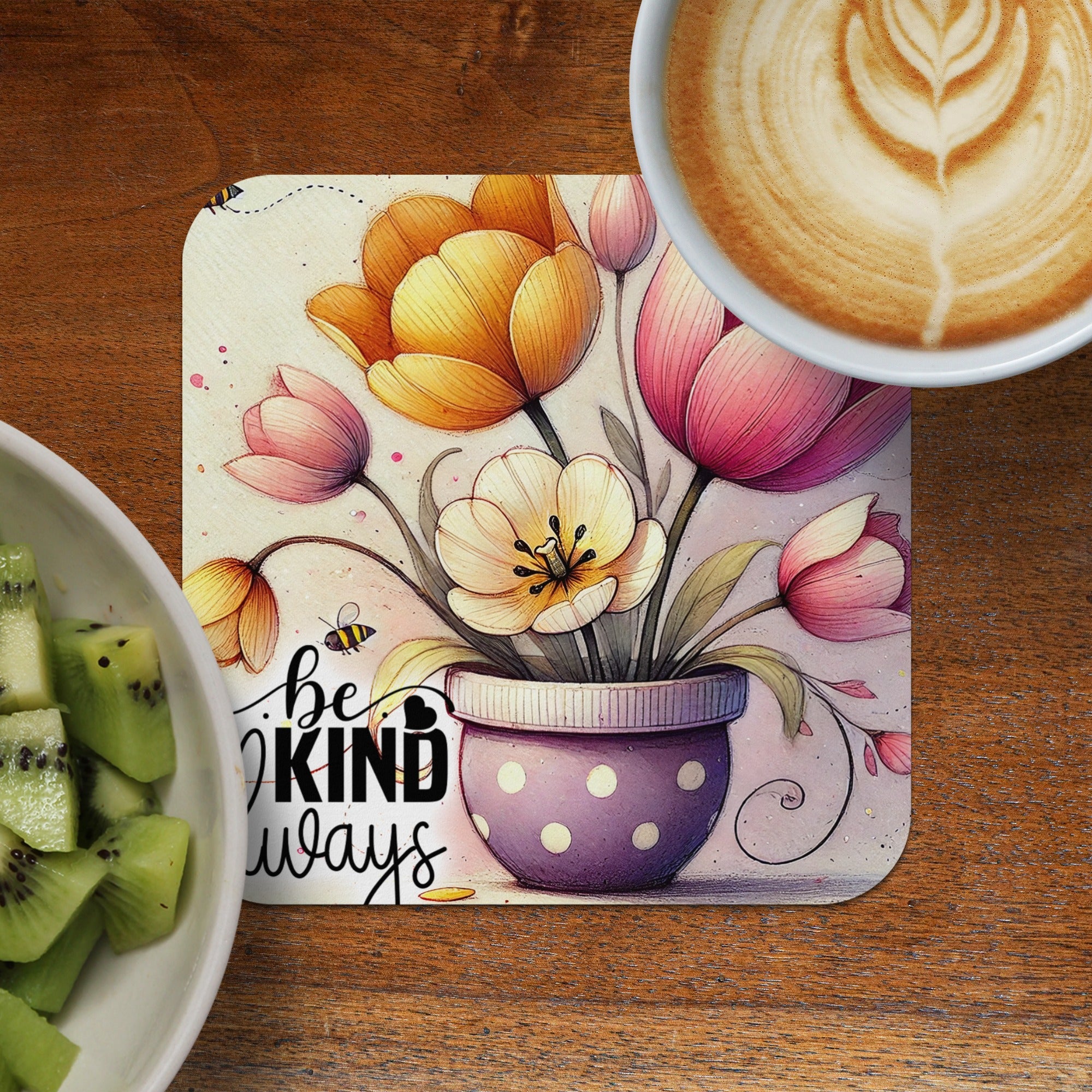 Tulip bouquet in purple polka dot pot with "Be Kind Always" text.