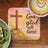 Cross with flowers and "God is good all time" text, coffee, and kiwi.