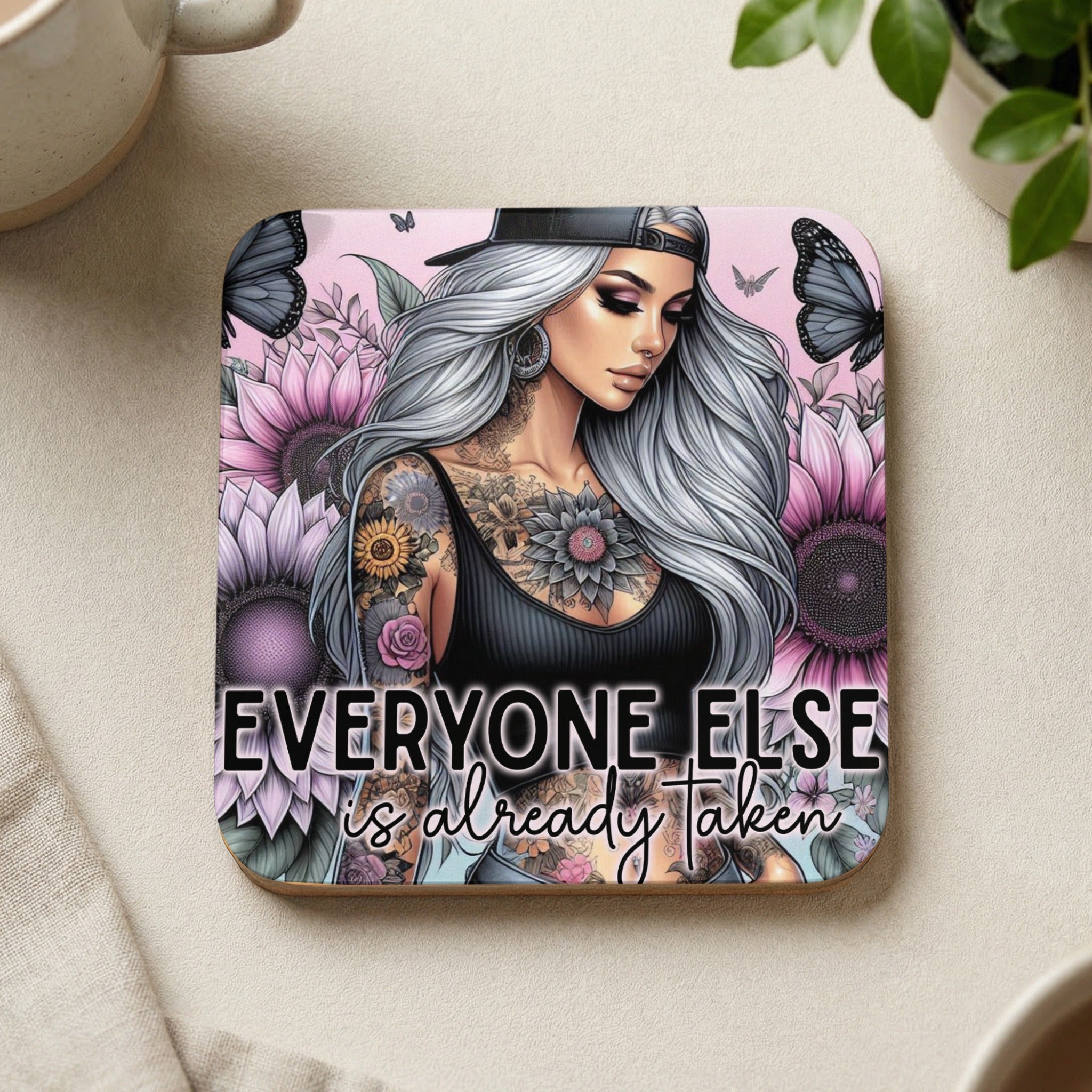 Woman with tattoos and sunflowers, text "Everyone Else Is Already Taken".