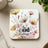 Coaster with floral design and "be kind always" text.