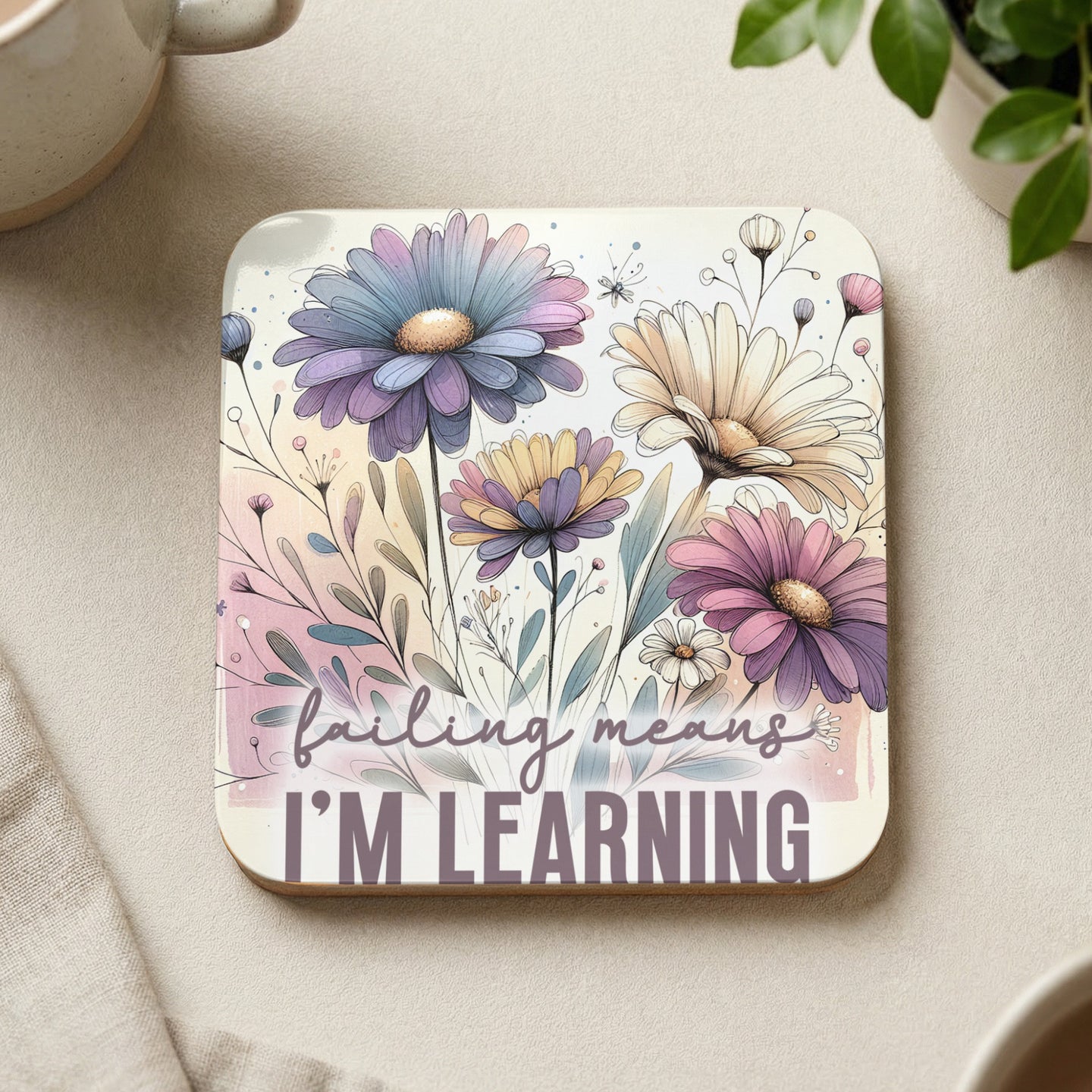 Square coaster with pastel flowers and text "failing means I'm learning".