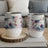 Two white insulated tumblers with dragonfly and floral watercolor design.