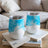 Two white stemless wine tumblers with blue watercolor patterns.