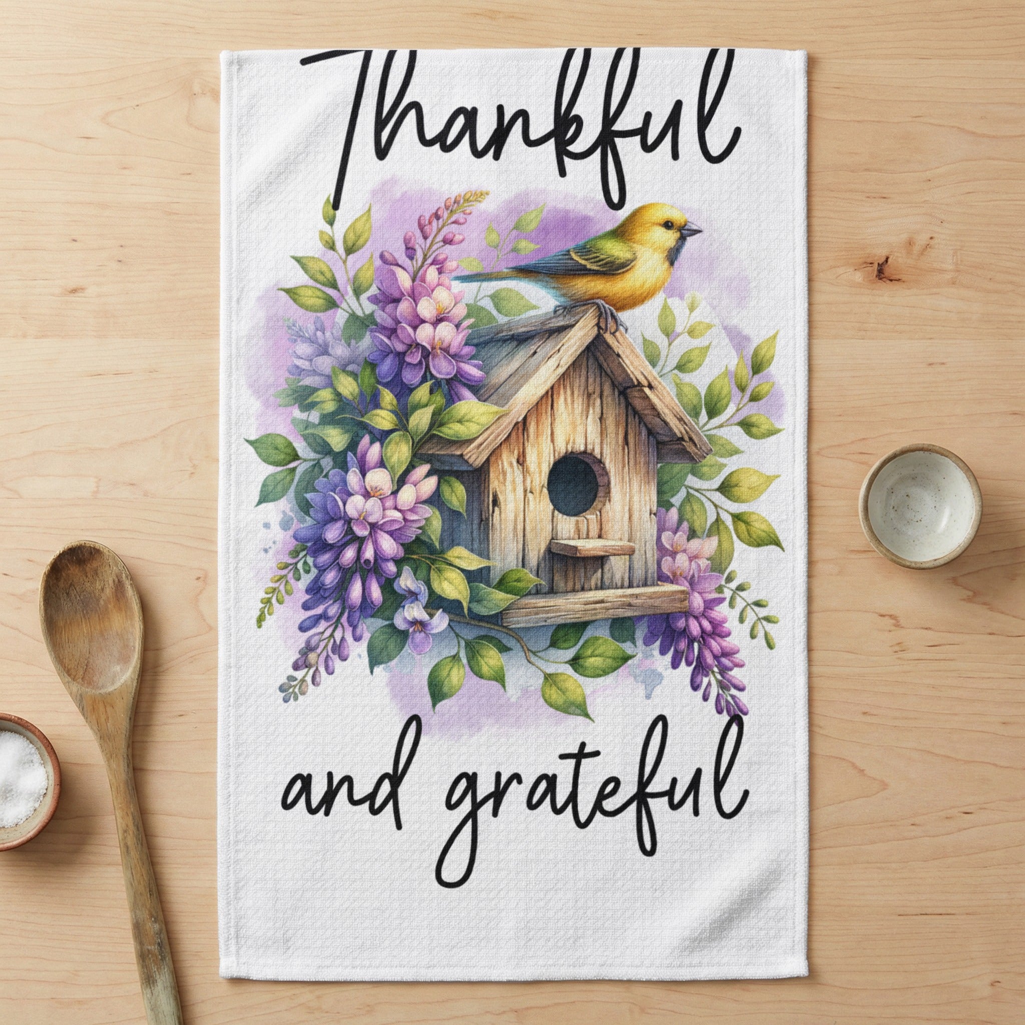 Birdhouse with "Thankful and grateful" text, surrounded by flowers and greenery.