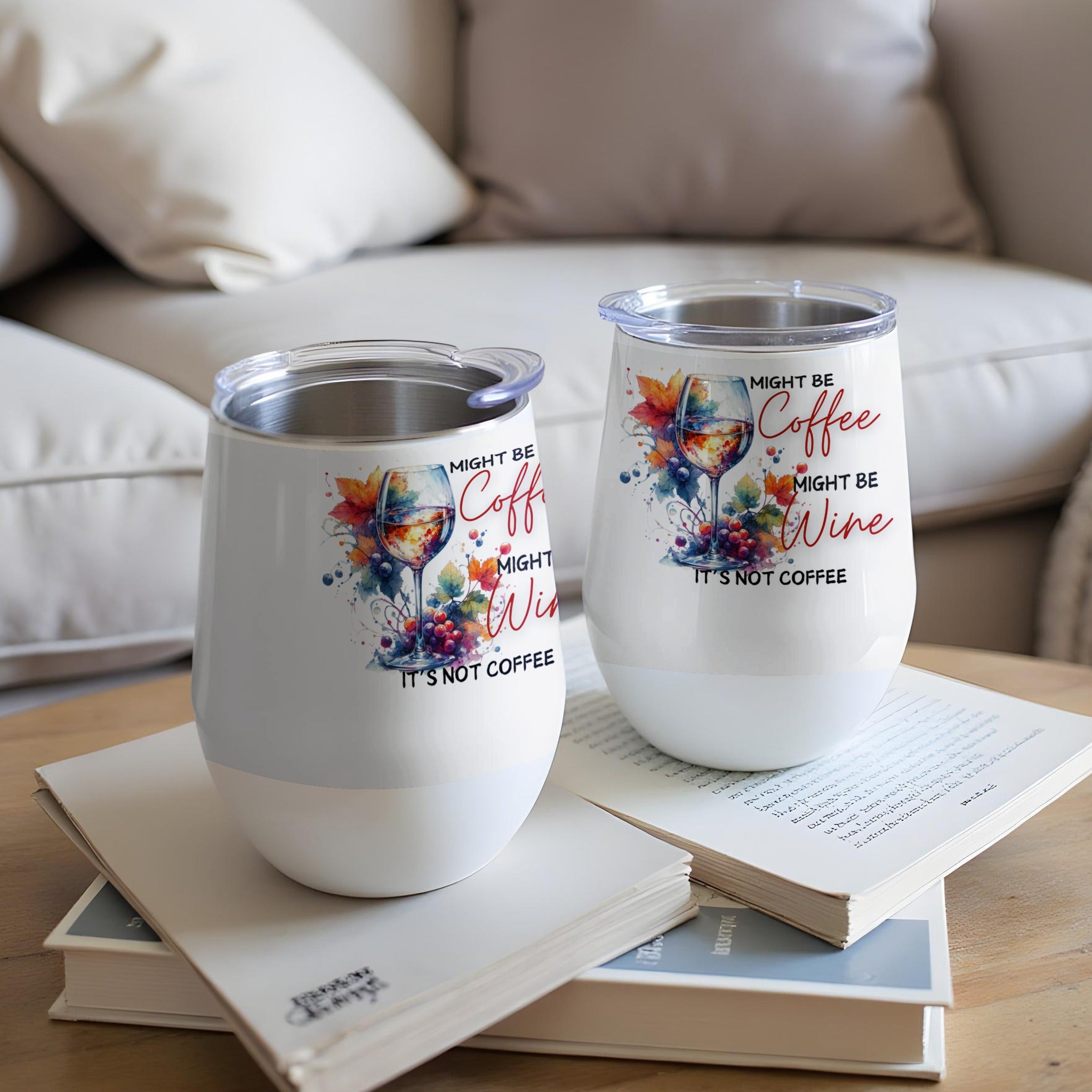 Two white tumblers with "Might be coffee, might be wine" text and watercolor art.