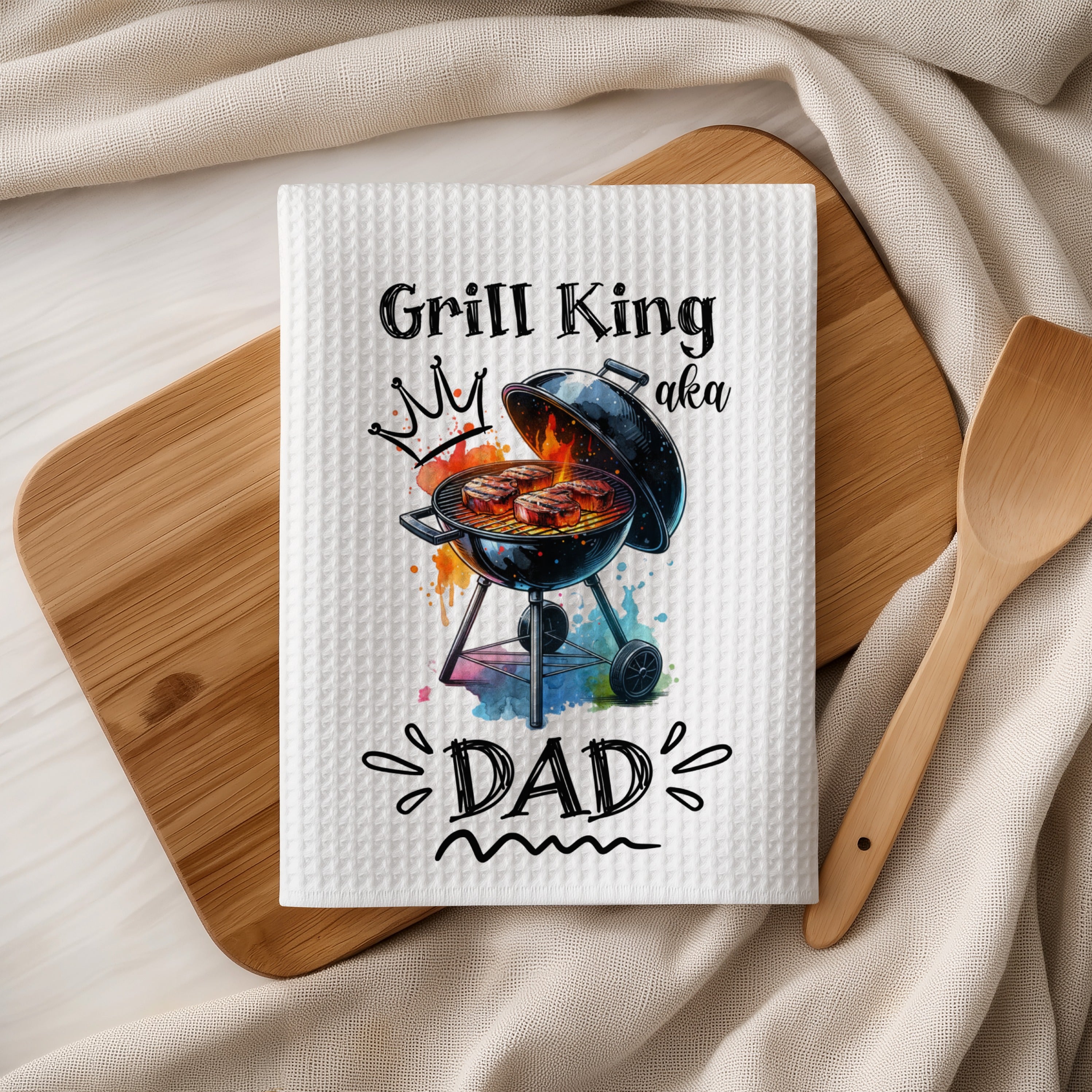 White waffle weave kitchen towel with Grill King aka Dad graphic.