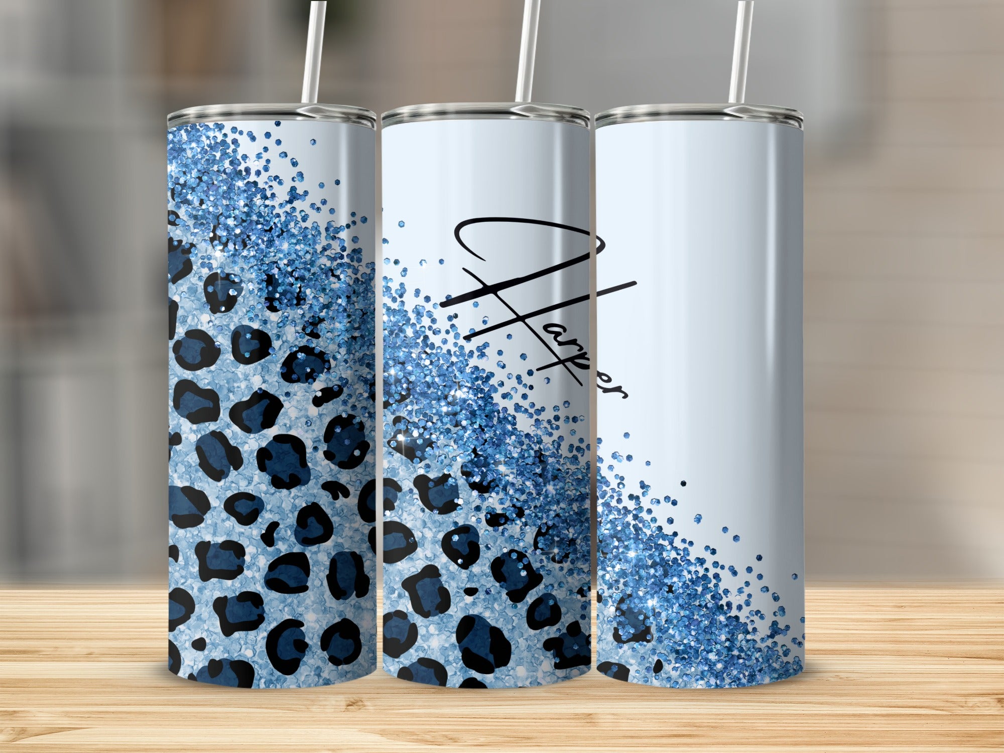 Three tumblers with leopard print and blue glitter design.