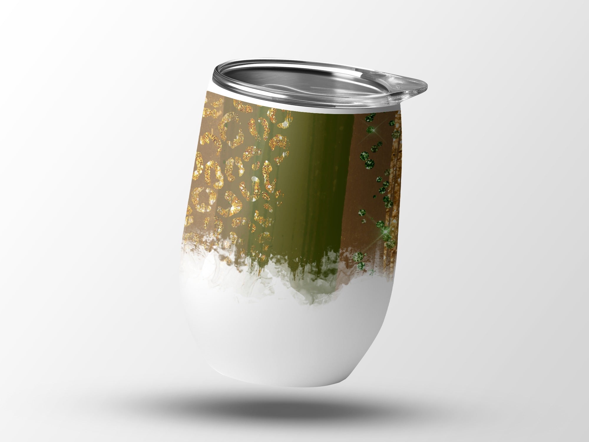 White tumbler with green and gold glitter brushstroke design.