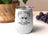 White wine tumbler with "Wine is cheaper than therapy" slogan and wine glass graphic.